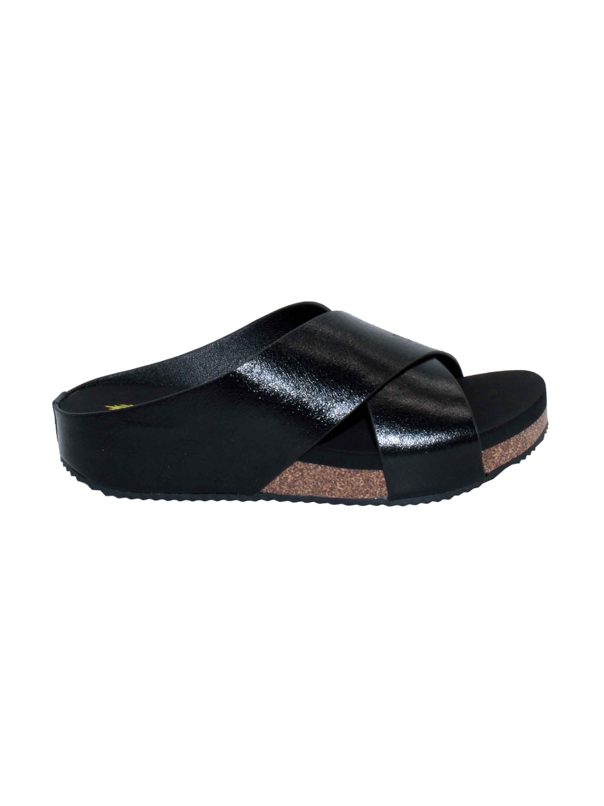 Rustic genuine leather black Slip-on crisscross sandal style Round toe shape Ultra-comfort EVA insole Cork covered wedge Rubber traction outsole Approx. 1.25” heel height