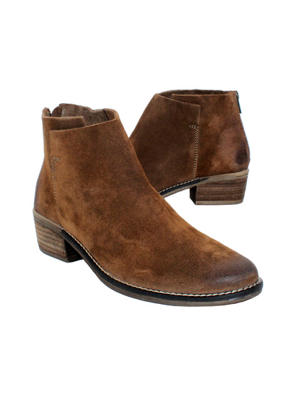 Very Volatile’s hand burnished suede ‘Aldworth’ bootie has an asymmetrical topline that adds effortless appeal to this wardrobe essential. Featuring padded insoles set atop sturdy rubber outsoles with stack leather heels and rustic stitched leather welting. Style them with denim and feminine dresses alike.