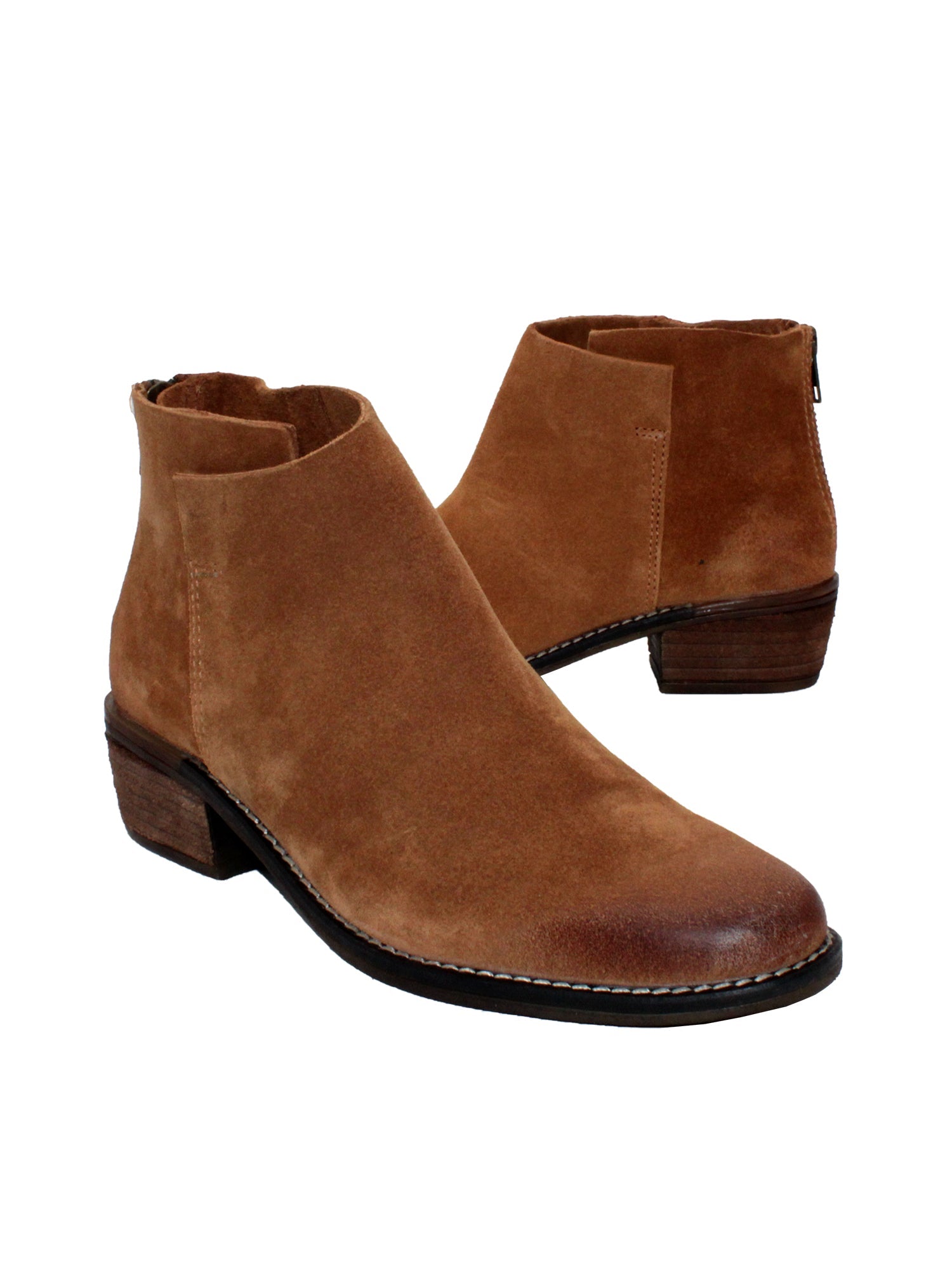 Very Volatile’s hand burnished suede ‘Aldworth’ bootie whiskey has an asymmetrical topline that adds effortless appeal to this wardrobe essential. Featuring padded insoles set atop sturdy rubber outsoles with stack leather heels and rustic stitched leather welting. 3/4 view angel