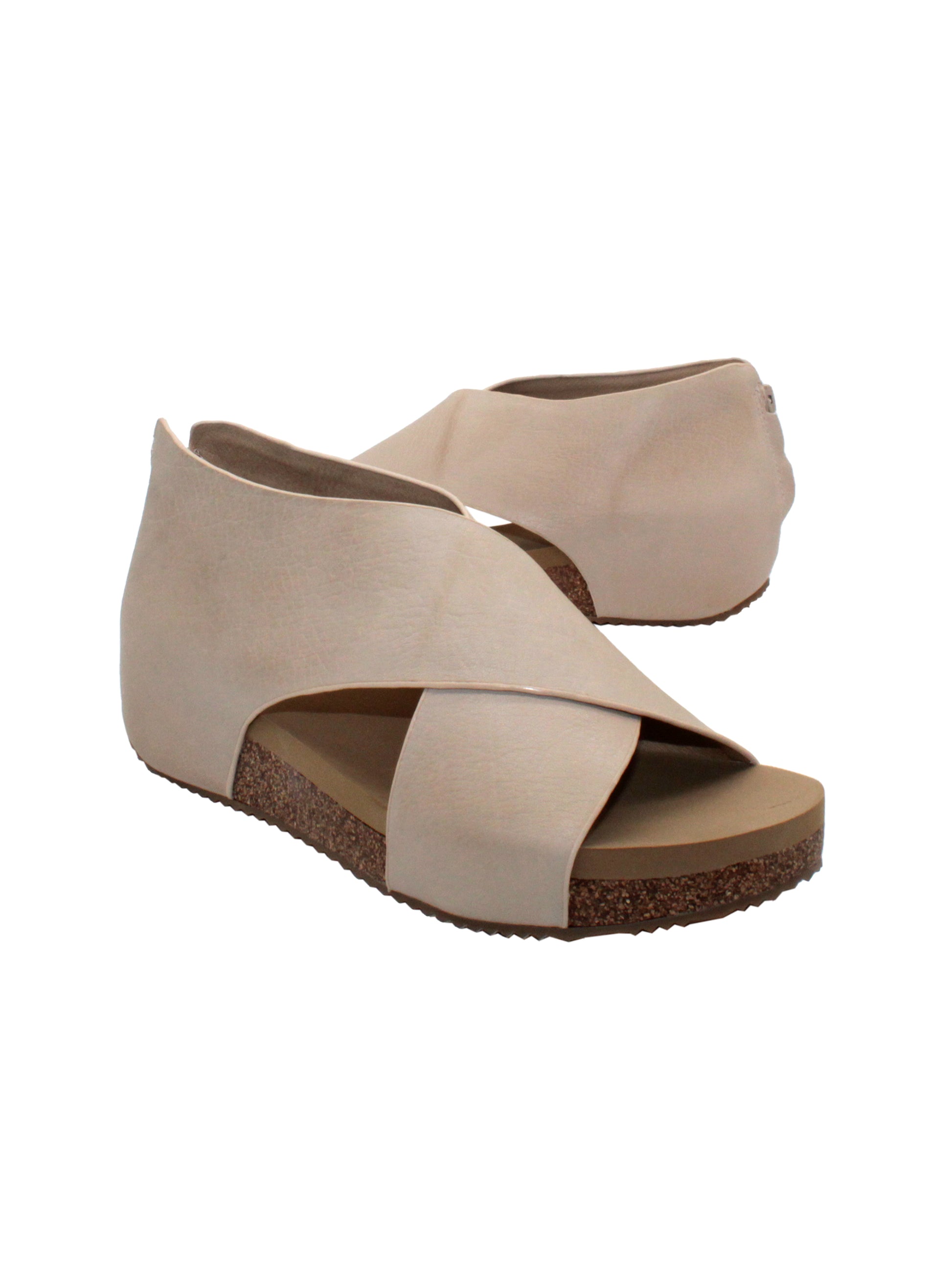The ‘Alton’ beige sandals by Volatile are made from plush genuine suede and designed with crisscross straps that meet in the back for a closed-but-open effect suitable for year-round styling. Featuring Volatile’s signature ultra-comfort EVA insole stationed on a modest low wedge, and durable, non-skid rubber traction soles, these are ideal for all day walking.