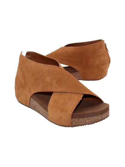 The ‘Alton’ tan sandals by Volatile are made from plush genuine suede and designed with crisscross straps that meet in the back for a closed-but-open effect suitable for year-round styling. Featuring Volatile’s signature ultra-comfort EVA insole stationed on a modest low wedge, and durable, non-skid rubber traction soles, these are ideal for all day walking.