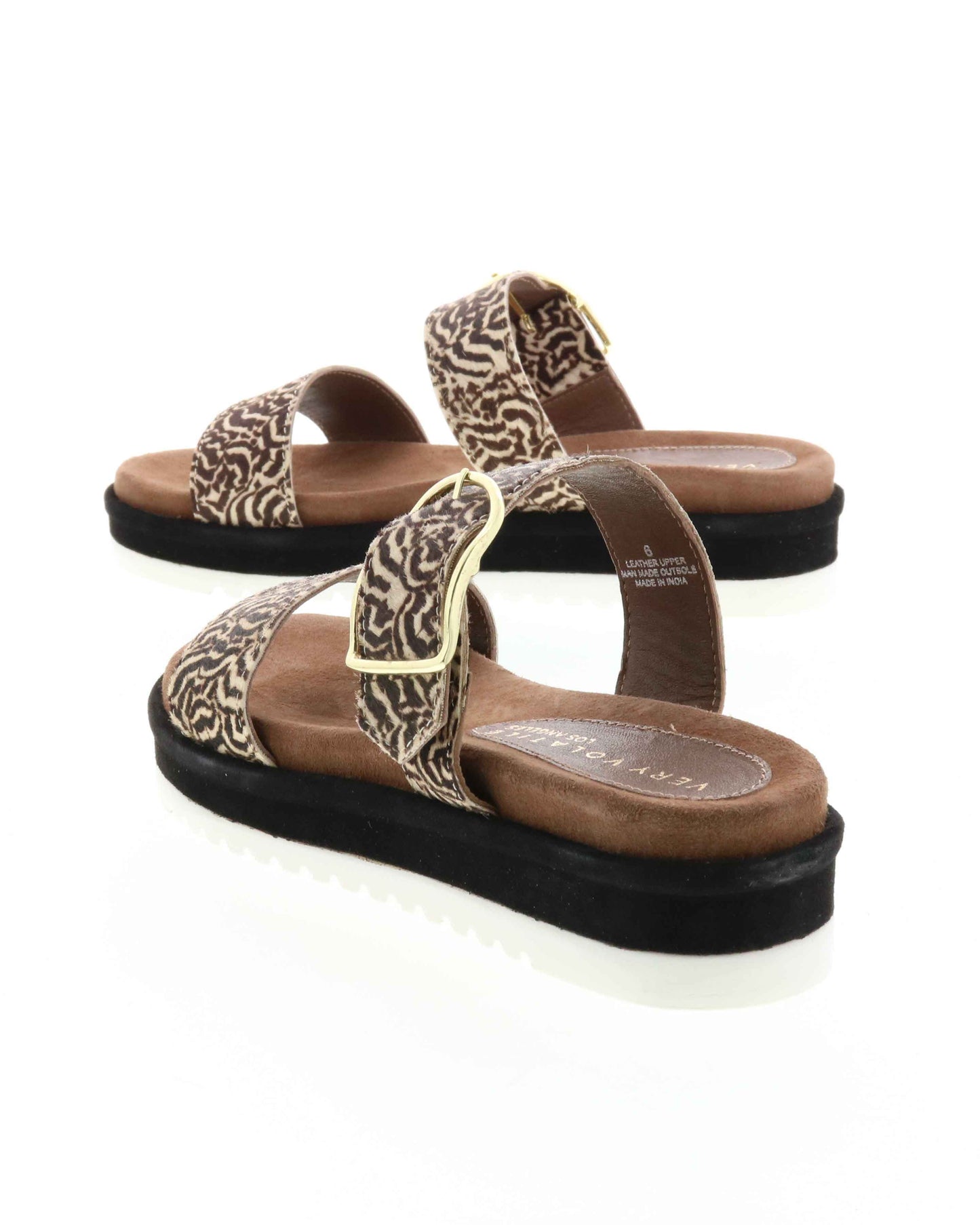 DOUBLE STRAP MINI FLATFORM SANDAL - Genuine calf-hair upper - Leather lining - Adjustable metal buckle - Two band slip-on sandal style - Anatomic suede covered footbed - Suede covered low platform bottom - White ridged outsole - Approx. 1.5" heel height back
