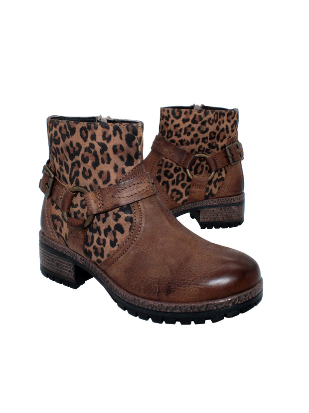Leather and microfiber leopard printed upper Harness detail with metal buckle and O rings Internal nylon zipper Easy on and off moto bootie style Padded insole Approx. 4.75” shaft height Approx. 1.75" heel height Rubber lug bottom outsole3/4 angle