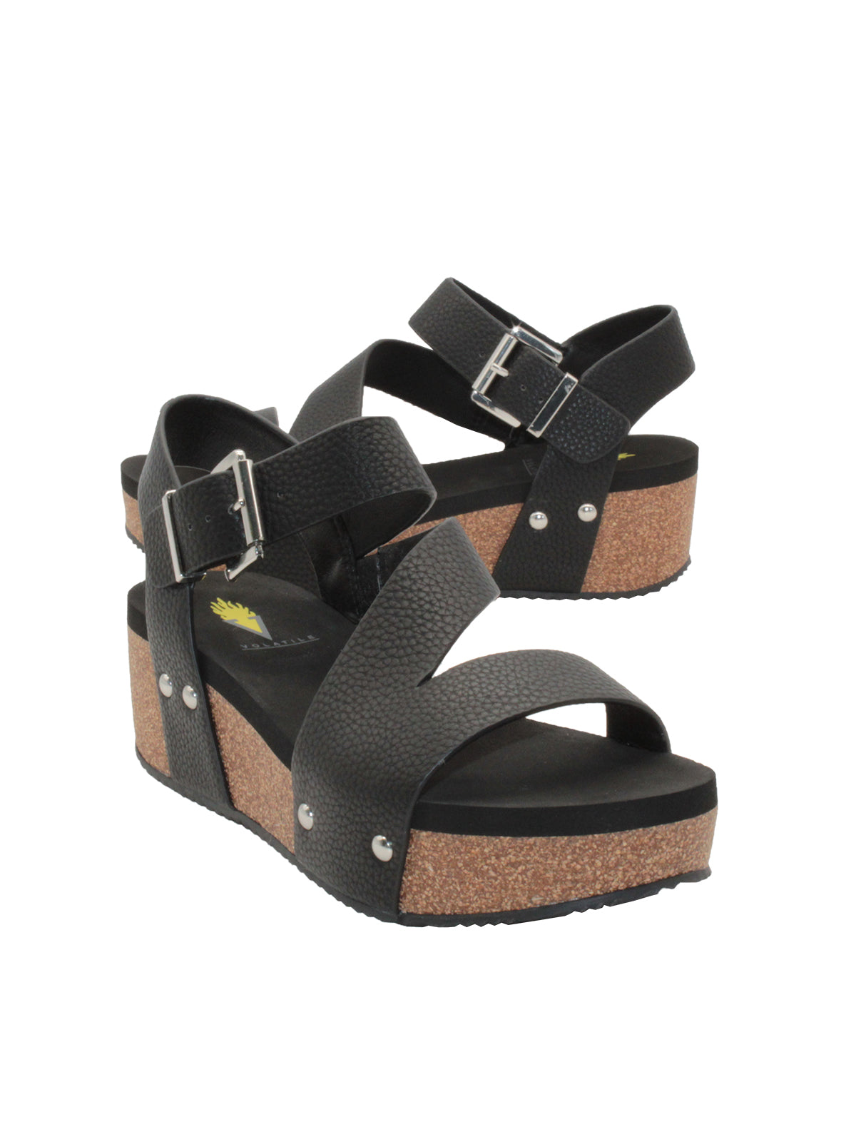 Vegan leather or heavy canvas asymmetrical upper Synthetic lining Adjustable metal buckle and metal clog studs Asymmetrical sandal with back strap Ultra comfort EVA insole Cork wedge Rubber traction outsole Approx. 2” heel height black 3/4 angle