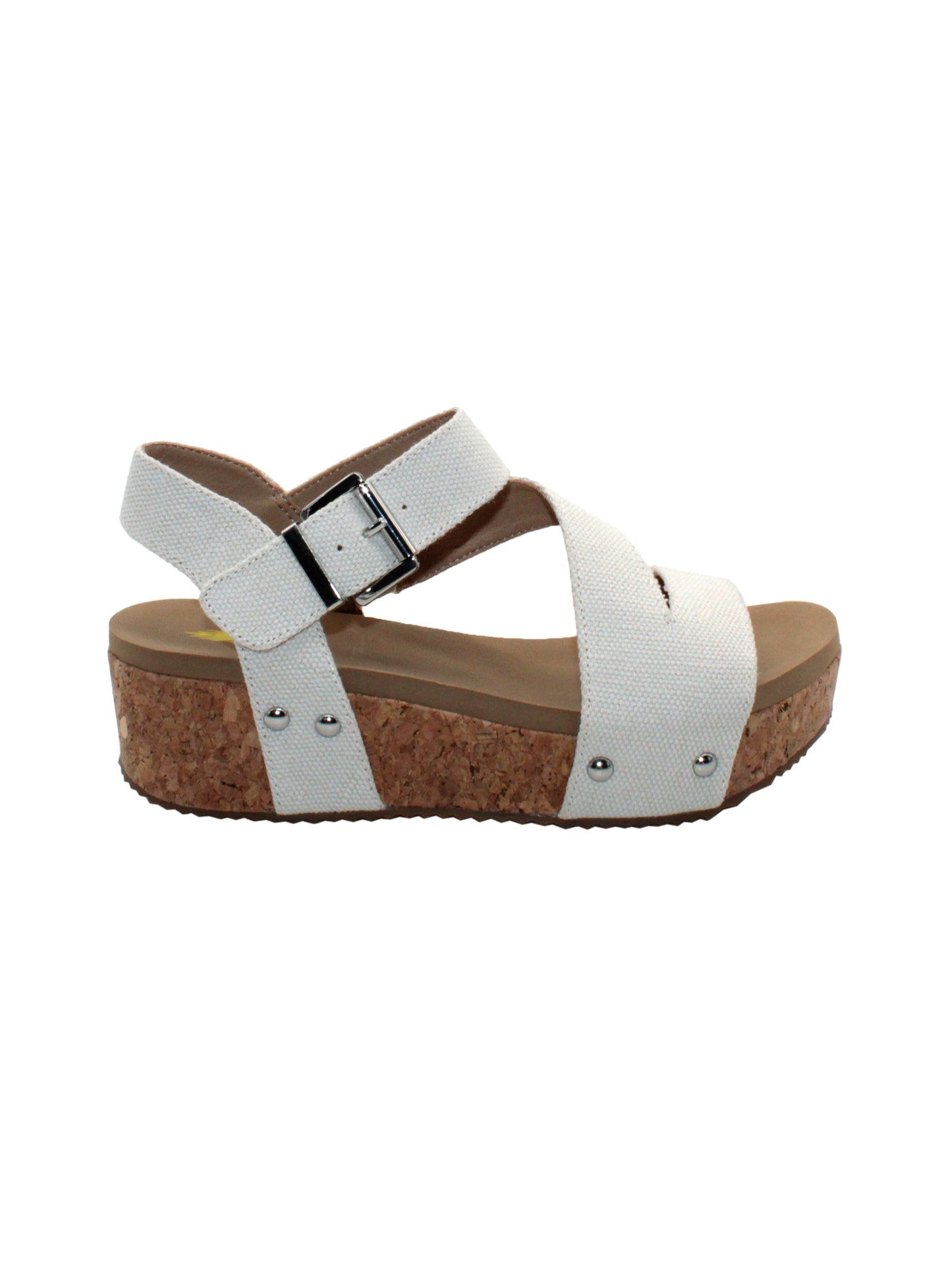 Vegan leather or heavy canvas asymmetrical upper Synthetic lining Adjustable metal buckle and metal clog studs Asymmetrical sandal with back strap Ultra comfort EVA insole Cork wedge Rubber traction outsole Approx. 2” heel height ivory side