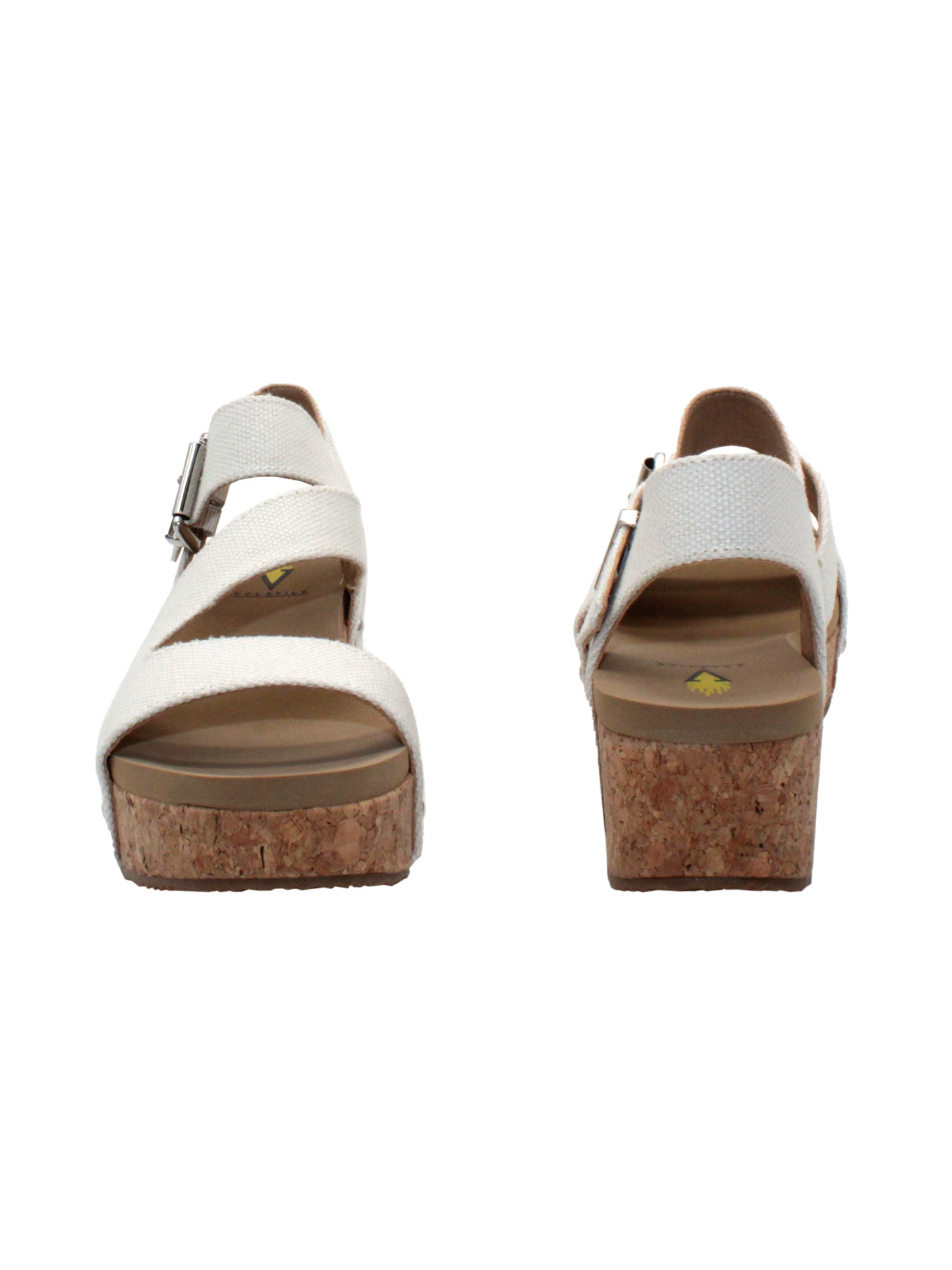 Vegan leather or heavy canvas asymmetrical upper Synthetic lining Adjustable metal buckle and metal clog studs Asymmetrical sandal with back strap Ultra comfort EVA insole Cork wedge Rubber traction outsole Approx. 2” heel height ivory front and back