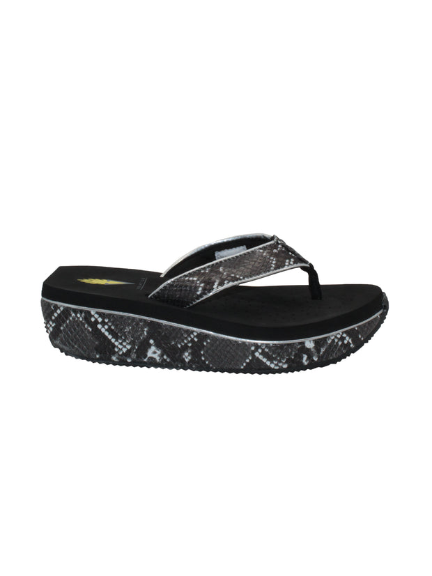 Faux snakeskin upper Soft webbed textile thong post Padded textile lining for comfort Slip-on thong wedge style Ultra-comfort EVA insole Round toe and squared off heel shape Rubber traction outsole Approx. 1.5” wedge heel height SIDE