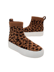 Stretch knit upper with back pull tab Stretch knit lining Internal nylon zipper Slip-on bootie sneaker style Signature ultra comfort EVA insole Approx. 3.5” shaft height Textured rubber sneaker bottom leopard 