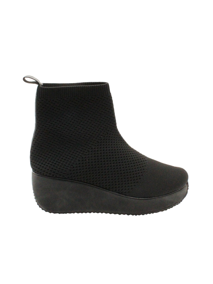 Stretch knit upper Stretch knit lining Pull-on wedge bootie with back pull tab Padded insole Round toe shape Rubber traction outsole Approx. 5” shaft height Approx. 2.25” heel height side
