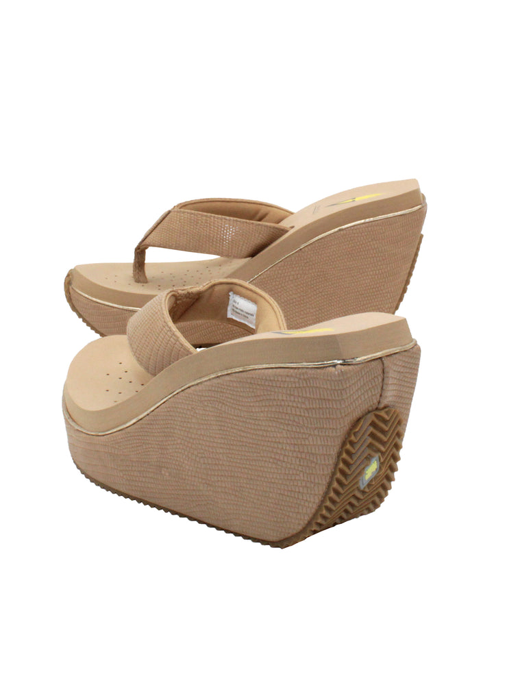 Volatile’s ‘Canova’ platform wedge sandals have been made from faux embossed lizard in super versatile neutral tones. The classic thong style has a soft fabric post that rests gently between your toes and our signature ultra-comfort EVA insole provides all day comfort. Wear yours with anything from midi skirts to cropped jeans. beige
