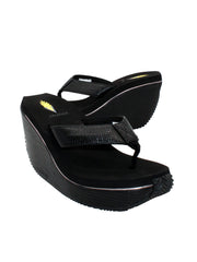 Volatile’s ‘Canova’ platform wedge sandals have been made from faux embossed lizard in super versatile neutral tones. The classic thong style has a soft fabric post that rests gently between your toes and our signature ultra-comfort EVA insole provides all day comfort. Wear yours with anything from midi skirts to cropped jeans. black 