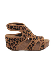 The leopard Chalet cut out sandal wedge by Volatile features a stretch knit upper inspired by running shoes set upon our signature ultra comfort EVA insole. The cork wedge is stationed on a rubber traction outsole that offers stability on all surfaces. side