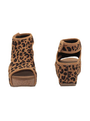 The leopard Chalet cut out sandal wedge by Volatile features a stretch knit upper inspired by running shoes set upon our signature ultra comfort EVA insole. The cork wedge is stationed on a rubber traction outsole that offers stability on all surfaces. front and back