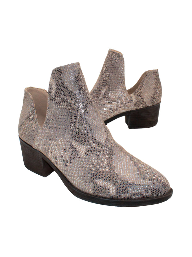 Our fan favorite beige multi CHRONICLE bootie by Volatile has been crafted in exotic materials, embossed faux croco or multicolored faux snake, for the new fall season. The upper features an attractive open shank that complement dresses and jeans alike.  3/4 angle