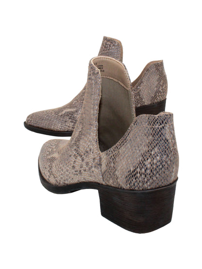 Our fan favorite beige multi CHRONICLE bootie by Volatile has been crafted in exotic materials, embossed faux croco or multicolored faux snake, for the new fall season. The upper features an attractive open shank that complement dresses and jeans alike. 