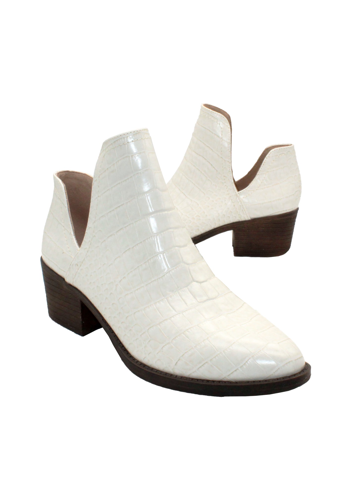 Our fan favorite bone croco CHRONICLE bootie by Volatile has been crafted in exotic materials, embossed faux croco or multicolored faux snake, for the new fall season. The upper features an attractive open shank that complement dresses and jeans alike. 3/4 angle
