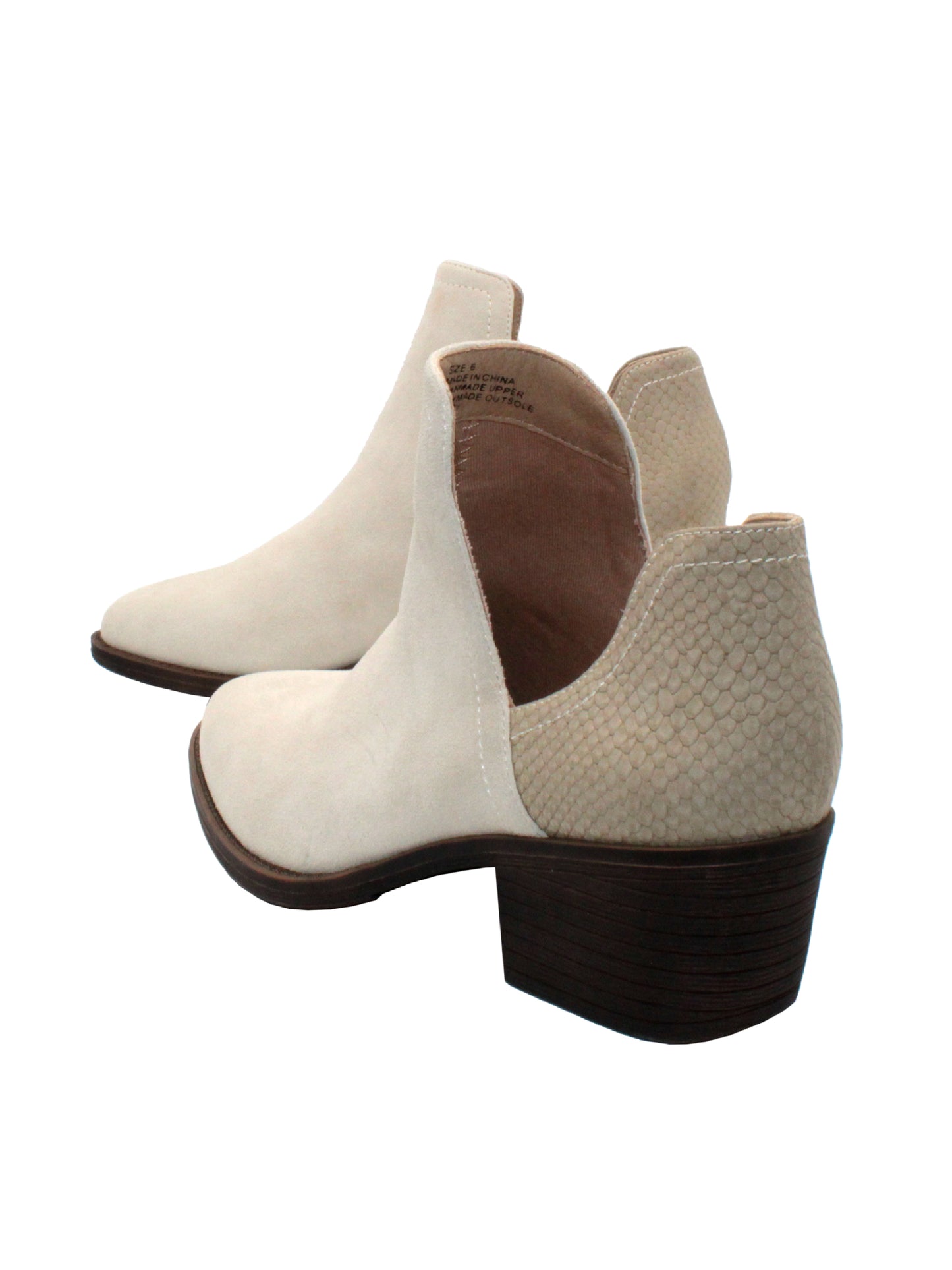Our fan favorite CHRONICLE bootie by Volatile has been crafted in exotic materials, embossed faux croco or multicolored faux snake, for the new fall season. The upper features an attractive open shank that complement dresses and jeans alike. The padded insole is stationed atop a flexible and sturdy rubber outsole.