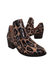Our fan favorite leopard CHRONICLE bootie by Volatile has been crafted in exotic materials, embossed faux croco or multicolored faux snake, for the new fall season. The upper features an attractive open shank that complement dresses and jeans alike. 3/4 angle