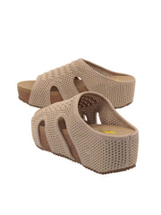 Volatile’s beige stretch knit open toe slide sandal wedge, Covey, takes an ergonomic approach, combining activewear comfort with a fashion silhouette. The stretch knit upper is inspired by running shoes and hugs the foot like a sock while the signature ultra comfort EVA insole is perfect for spending the entire day on your feet. The rubber traction outsole makes these ideal for walking on all surfaces, pair them with cargo shorts for exploring a new city on your next vacation.4