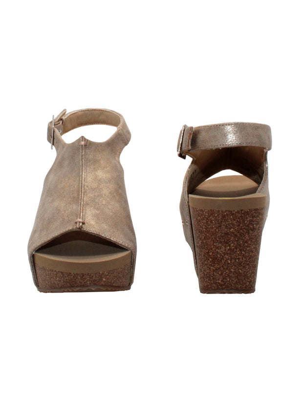 One of Volatile’s beige classic signature styles, the Division wedge sandal brings ultra-comfort to casual fashion like no other. The adjustable ankle strap offers stability, the padded lining and signature ultra-comfort EVA insole keeps feet feeling rested even after a full day of adventure, and the rubber traction outsole means these are safe for walking on any surface. Pack these for your next trip to wear with shorts for sightseeing and a flowy dress for special events. front and back