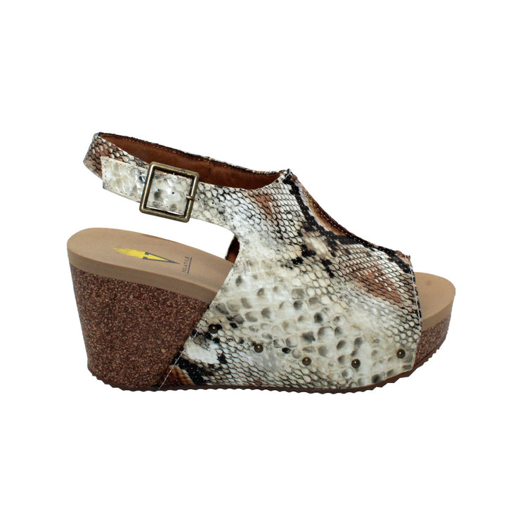 One of Volatile’s classic signature styles, the beige snake multi Division wedge sandal brings ultra-comfort to casual fashion like no other. The adjustable ankle strap offers stability, the padded lining and signature ultra-comfort EVA insole keeps feet feeling rested even after a full day of adventure, and the rubber traction outsole means these are safe for walking on any surface. Pack these for your next trip to wear with shorts for sightseeing and a flowy dress for special events.