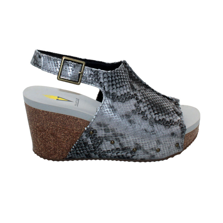 One of Volatile’s black snake multi classic signature styles, the Division wedge sandal brings ultra-comfort to casual fashion like no other. The adjustable ankle strap offers stability, the padded lining and signature ultra-comfort EVA insole keeps feet feeling rested even after a full day of adventure, and the rubber traction outsole means these are safe for walking on any surface. Pack these for your next trip to wear with shorts for sightseeing and a flowy dress for special events.