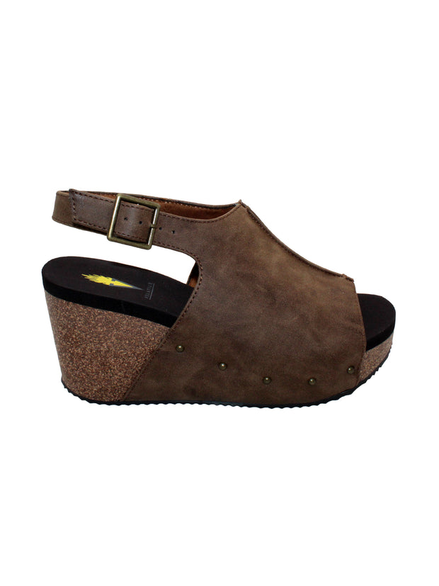 One of Volatile’s classic signature styles, the brown Division wedge sandal brings ultra-comfort to casual fashion like no other. The adjustable ankle strap offers stability, the padded lining and signature ultra-comfort EVA insole keeps feet feeling rested even after a full day of adventure, and the rubber traction outsole means these are safe for walking on any surface. Pack these for your next trip to wear with shorts for sightseeing and a flowy dress for special events.
