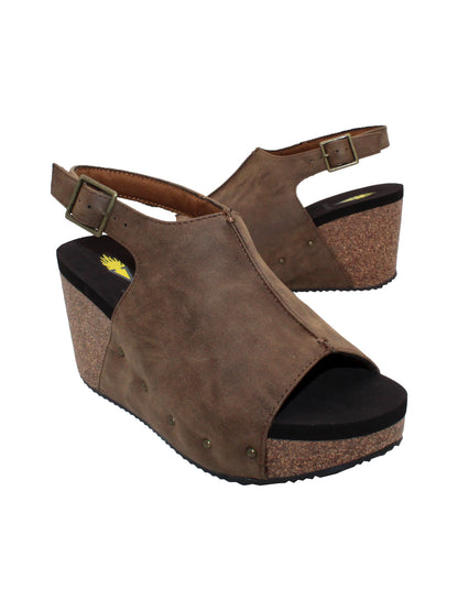One of Volatile’s classic signature styles, the brown Division wedge sandal brings ultra-comfort to casual fashion like no other. The adjustable ankle strap offers stability, the padded lining and signature ultra-comfort EVA insole keeps feet feeling rested even after a full day of adventure, and the rubber traction outsole means these are safe for walking on any surface. Pack these for your next trip to wear with shorts for sightseeing and a flowy dress for special events. 2