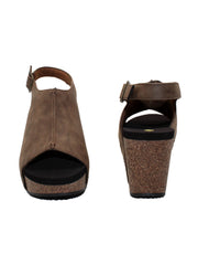 One of Volatile’s classic signature styles, the brown Division wedge sandal brings ultra-comfort to casual fashion like no other. The adjustable ankle strap offers stability, the padded lining and signature ultra-comfort EVA insole keeps feet feeling rested even after a full day of adventure, and the rubber traction outsole means these are safe for walking on any surface. Pack these for your next trip to wear with shorts for sightseeing and a flowy dress for special events. front and back