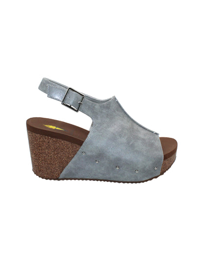 One of Volatile’s Grey classic signature styles, the Division wedge sandal brings ultra-comfort to casual fashion like no other. The adjustable ankle strap offers stability, the padded lining and signature ultra-comfort EVA insole keeps feet feeling rested even after a full day of adventure, and the rubber traction outsole means these are safe for walking on any surface. Pack these for your next trip to wear with shorts for sightseeing and a flowy dress for special events.