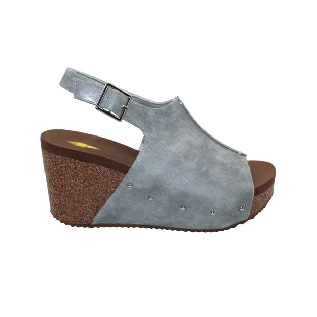 One of Volatile’s Grey classic signature styles, the Division wedge sandal brings ultra-comfort to casual fashion like no other. The adjustable ankle strap offers stability, the padded lining and signature ultra-comfort EVA insole keeps feet feeling rested even after a full day of adventure, and the rubber traction outsole means these are safe for walking on any surface. Pack these for your next trip to wear with shorts for sightseeing and a flowy dress for special events.