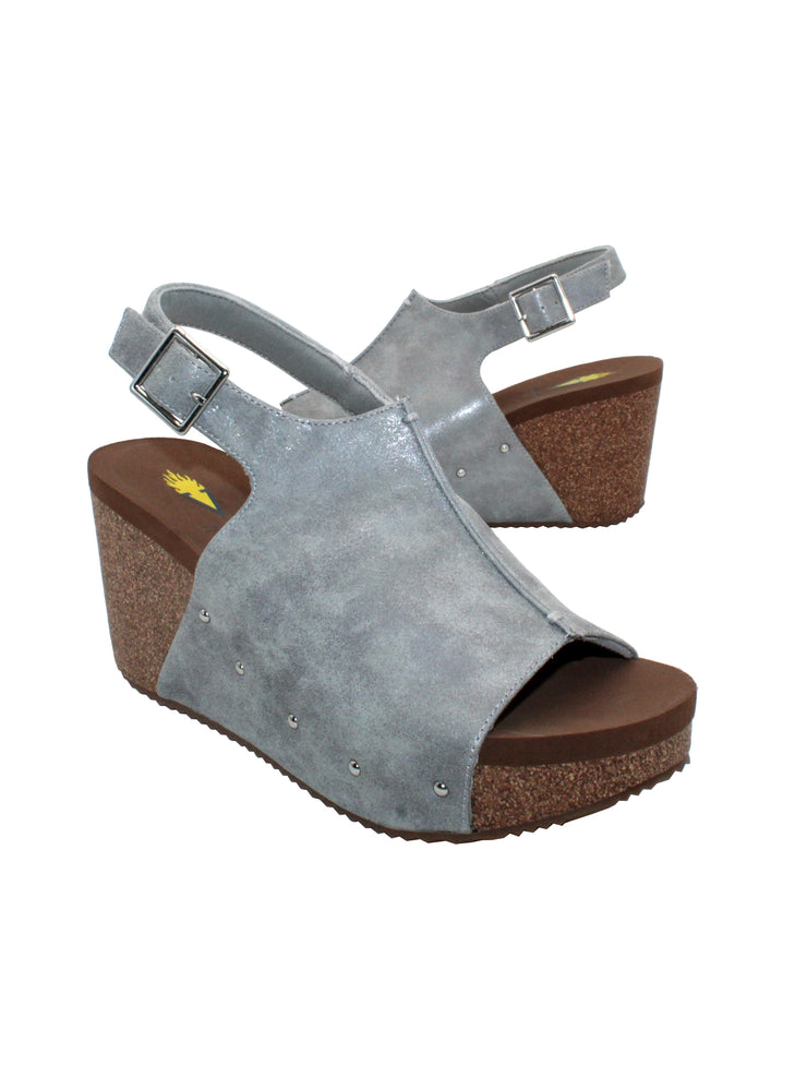 One of Volatile’s Grey classic signature styles, the Division wedge sandal brings ultra-comfort to casual fashion like no other. The adjustable ankle strap offers stability, the padded lining and signature ultra-comfort EVA insole keeps feet feeling rested even after a full day of adventure, and the rubber traction outsole means these are safe for walking on any surface. Pack these for your next trip to wear with shorts for sightseeing and a flowy dress for special events. side