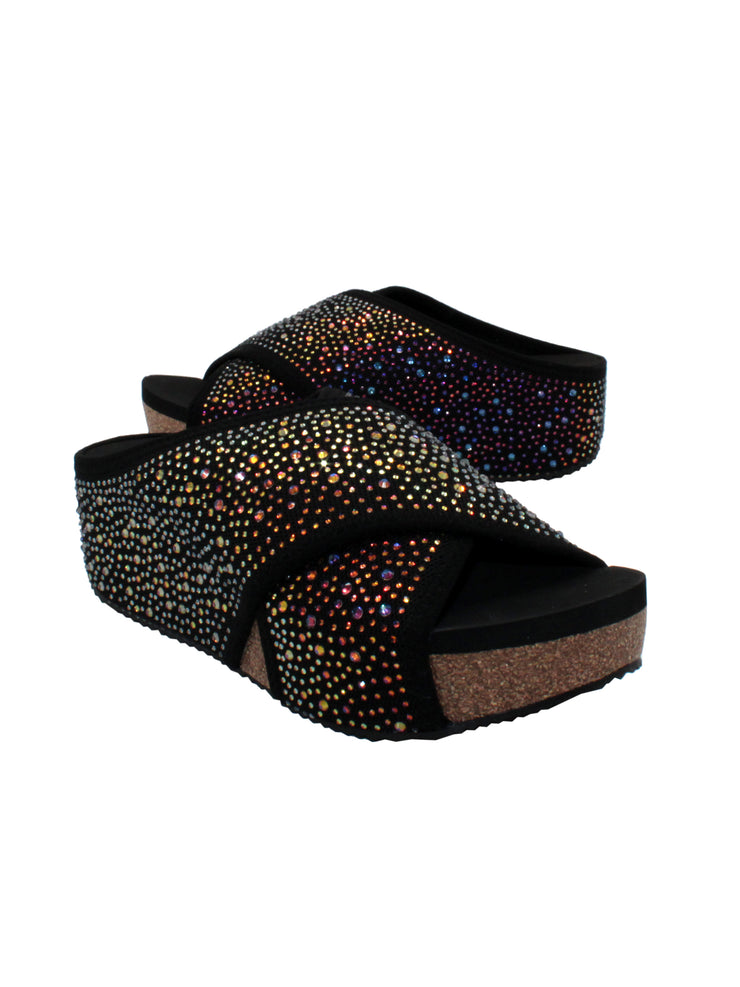 Volatile's Dixiedust crisscross slide is inspired by slippers. These sandals are ready to shine this Spring and Summer. These keep your feet cozy both indoors and outdoors, featuring Volatile’s signature ultra-comfort EVA insole and non-skid, durable rubber traction outsole. Try pairing them with a shiny dress or denim jeans. black 2 