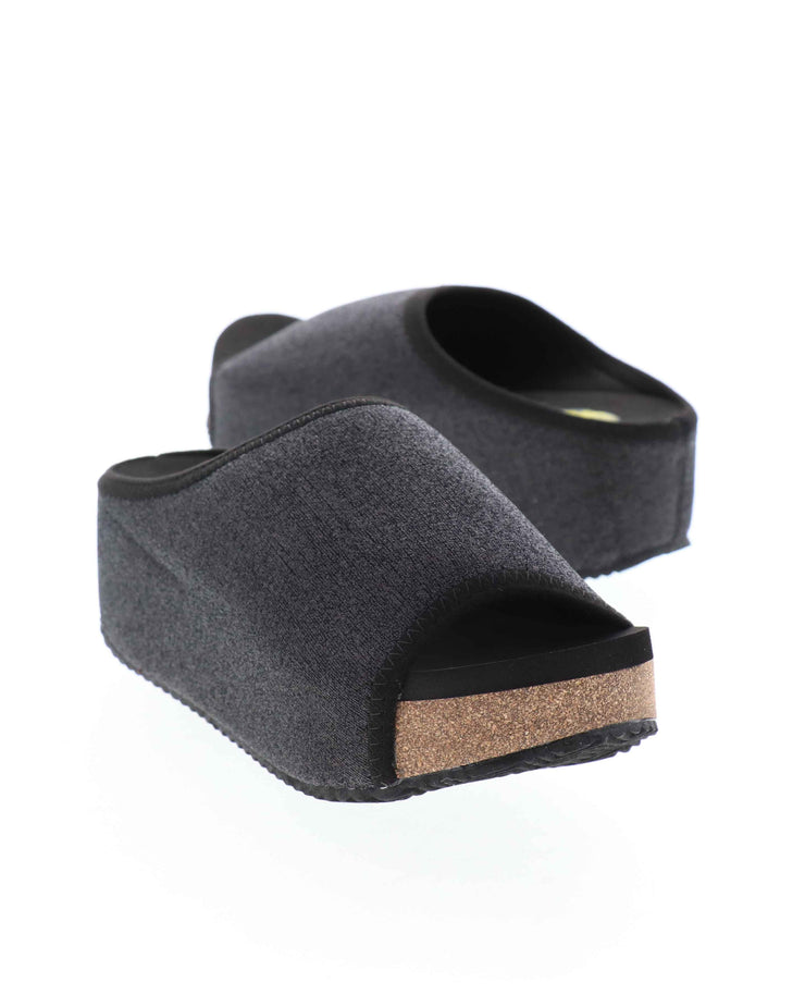 Volatile’s Festina open toe slide in sparkling stretch knit was an instant hit when it first launched and has since become one of our classic styles, offering total comfort in a chic silhouette with a shimmer to keep things joyful. The soft, stretch knit upper gently hugs the foot while our signature ultra comfort EVA insole keeps soles restful, even after a full day of being on your feet. Perfect for all day special events. black 
