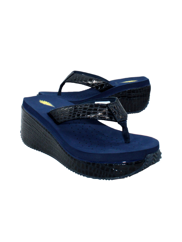  Volatile’s bestselling Frappachino wedge sandal is a style that transcends the trends and is available in our classic black and brown genuine leather versions, or, in this season’s new metallic embossed snake print for a fresh update. They feature Volatile’s signature ultra comfort EVA insole for all day comfort. navy croco 2