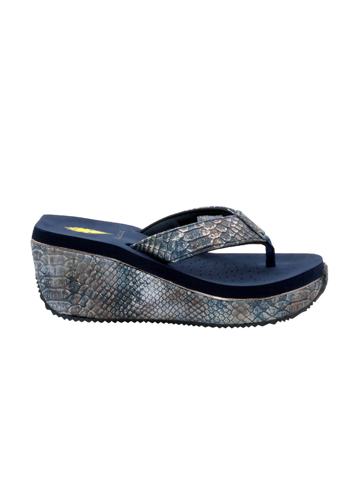 Volatile’s bestselling Frappachino wedge sandal is a style that transcends the trends and is available in our classic black and brown genuine leather versions, or, in this season’s new metallic embossed snake print for a fresh update. They feature Volatile’s signature ultra comfort EVA insole for all day comfort. navy metal snake