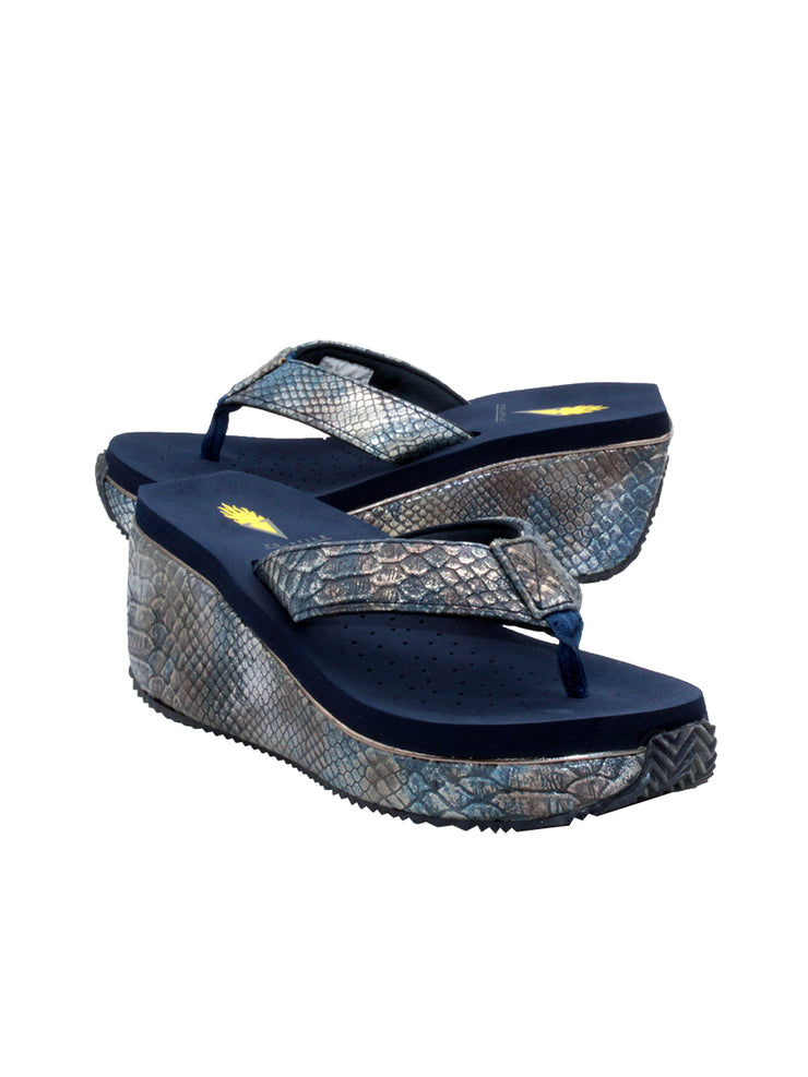Volatile’s bestselling Frappachino wedge sandal is a style that transcends the trends and is available in our classic black and brown genuine leather versions, or, in this season’s new metallic embossed snake print for a fresh update. They feature Volatile’s signature ultra comfort EVA insole for all day comfort. navy metal snake 2