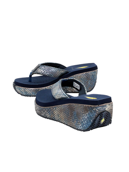 Volatile’s bestselling Frappachino wedge sandal is a style that transcends the trends and is available in our classic black and brown genuine leather versions, or, in this season’s new metallic embossed snake print for a fresh update. They feature Volatile’s signature ultra comfort EVA insole for all day comfort. navy metal snake 4