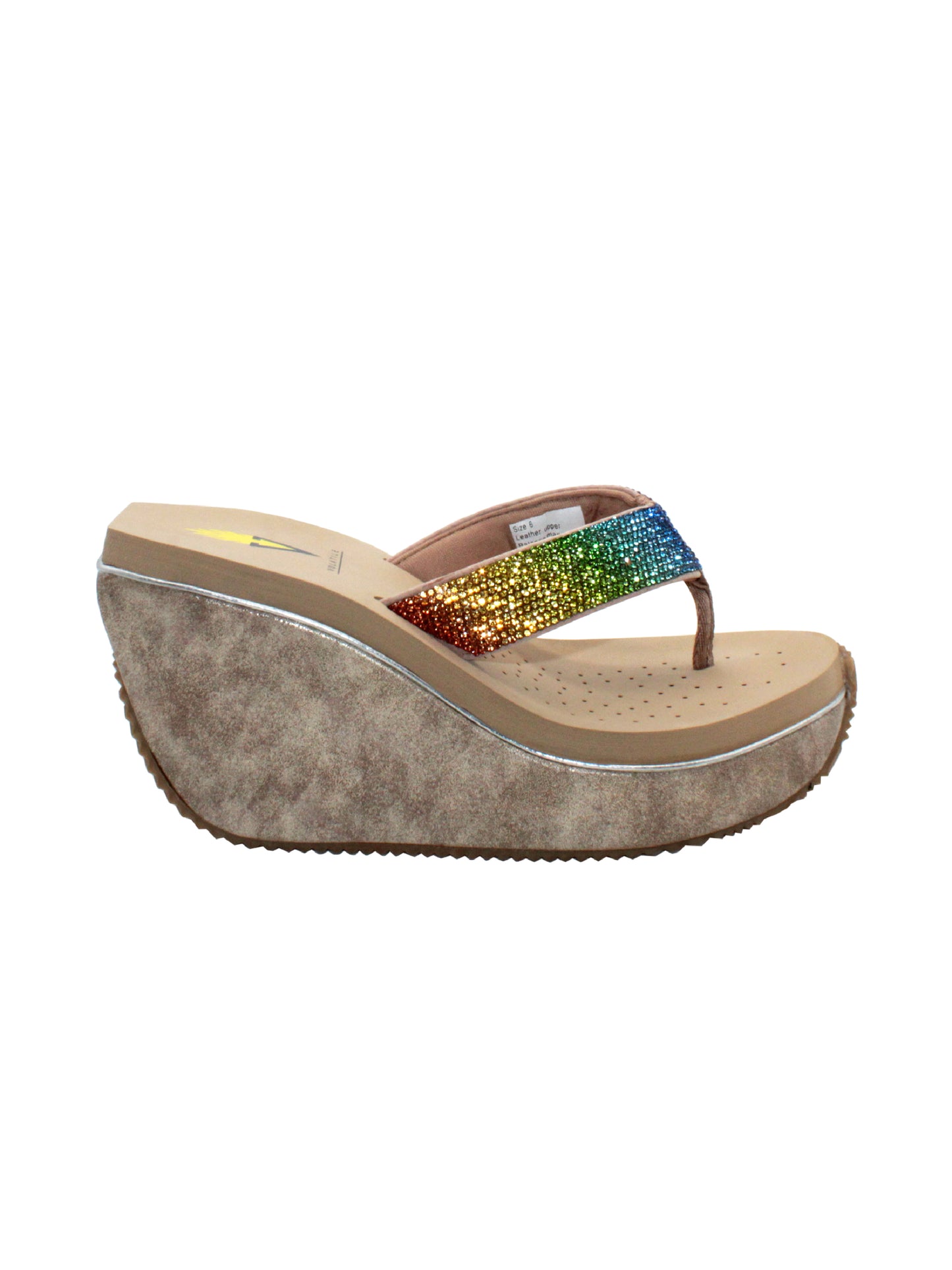 Volatile’s Glimpse platform wedge sandal’s leather upper straps are embellished with sparkling rhinestones. The classic thong style has a soft fabric post that rests gently between your toes, and the signature ultra-comfort EVA insole provides all day comfort. Perfect for special occasions, they’ll complement everything from dresses to jeans. beige multi