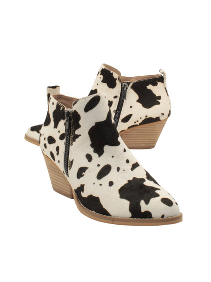Western inspired Gracemont booties from Very Volatile refresh your wardrobe with on-trend animal print in genuine calf hair. The functioning metal side zippers mean you can slip these on with your favorite pair of jeans and head straight into the weekend.  black white cow 2
