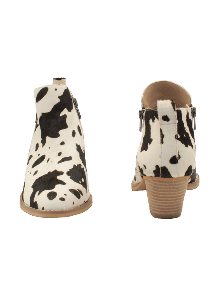 Western inspired Gracemont booties from Very Volatile refresh your wardrobe with on-trend animal print in genuine calf hair. The functioning metal side zippers mean you can slip these on with your favorite pair of jeans and head straight into the weekend.  black white cow 3