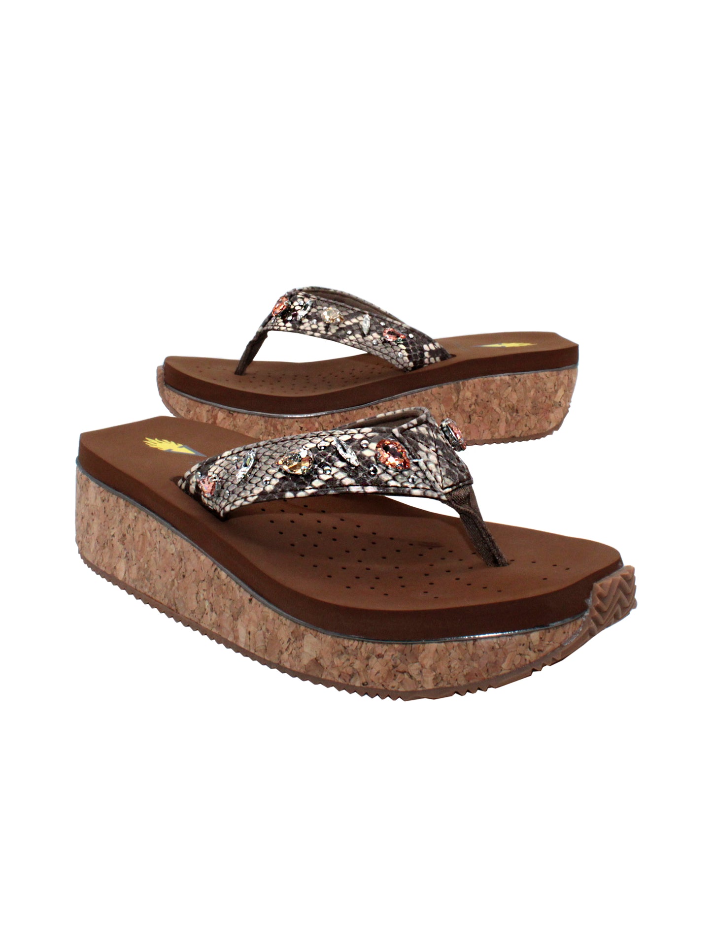 The Grand thong wedge sandal by Volatile is crafted in a textured synthetic python material adorned with cased jewels and studs. They feature Volatile’s signature ultra comfort EVA insole for all day comfort, padded textile lining and nonskid rubber traction outsoles to keep you at your best on your feet. Feel free to dress these up or down for any occasion. 2