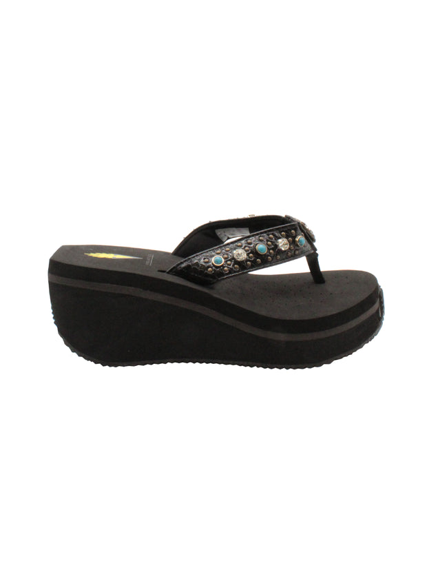 The Gypsy thong wedge sandal by Volatile is crafted in a textured synthetic python material adorned with cased jewels and studs. They feature Volatile’s signature ultra comfort EVA insole for all day comfort, padded textile lining and nonskid rubber traction outsoles to give you all day wear in style. Feel free to dress this sandal up or down or any occasion.