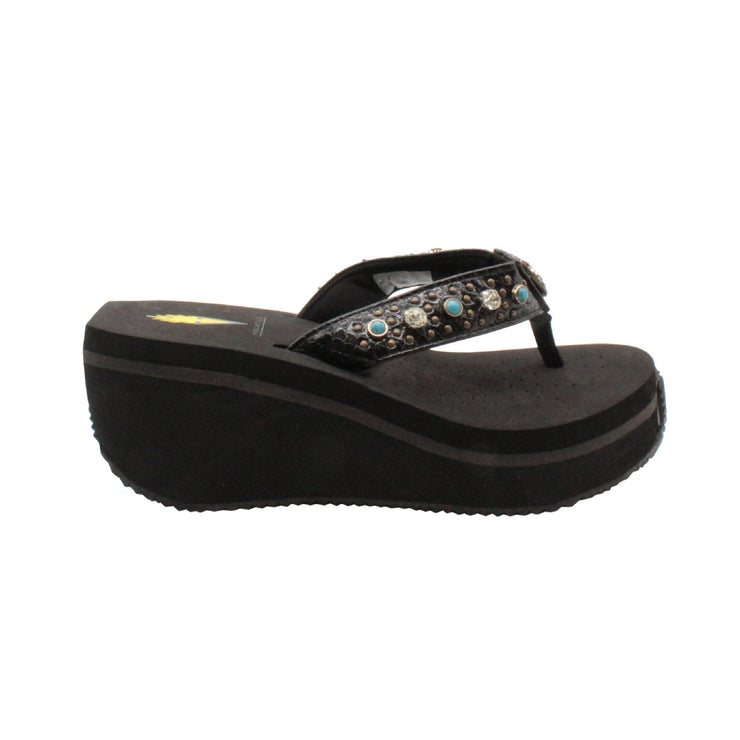 The Gypsy thong wedge sandal by Volatile is crafted in a textured synthetic python material adorned with cased jewels and studs. They feature Volatile’s signature ultra comfort EVA insole for all day comfort, padded textile lining and nonskid rubber traction outsoles to give you all day wear in style. Feel free to dress this sandal up or down or any occasion.