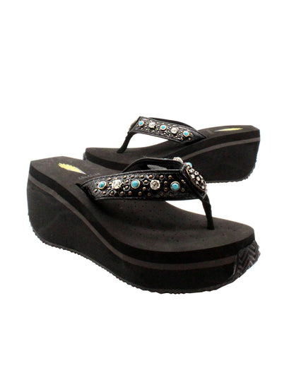 The Gypsy thong wedge sandal by Volatile is crafted in a textured synthetic python material adorned with cased jewels and studs. They feature Volatile’s signature ultra comfort EVA insole for all day comfort, padded textile lining and nonskid rubber traction outsoles to give you all day wear in style. Feel free to dress this sandal up or down or any occasion. 2