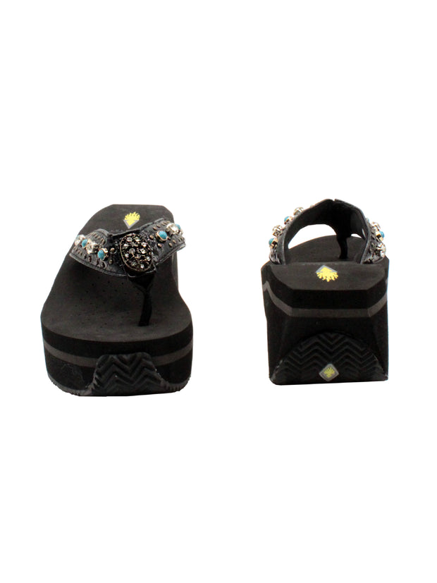 The Gypsy thong wedge sandal by Volatile is crafted in a textured synthetic python material adorned with cased jewels and studs. They feature Volatile’s signature ultra comfort EVA insole for all day comfort, padded textile lining and nonskid rubber traction outsoles to give you all day wear in style. Feel free to dress this sandal up or down or any occasion. 3