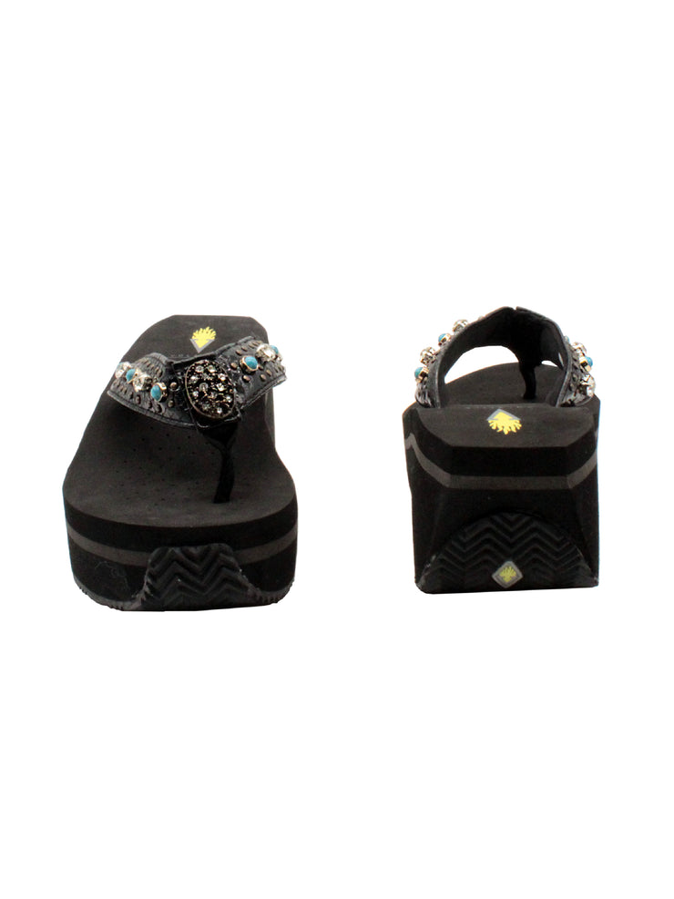 The Gypsy thong wedge sandal by Volatile is crafted in a textured synthetic python material adorned with cased jewels and studs. They feature Volatile’s signature ultra comfort EVA insole for all day comfort, padded textile lining and nonskid rubber traction outsoles to give you all day wear in style. Feel free to dress this sandal up or down or any occasion. 3