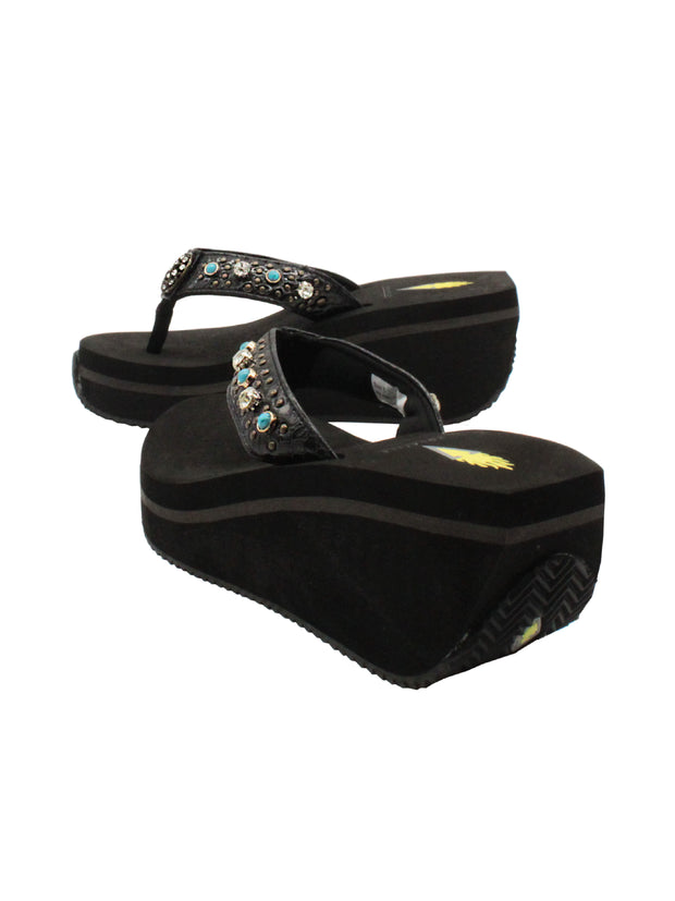 The Gypsy thong wedge sandal by Volatile is crafted in a textured synthetic python material adorned with cased jewels and studs. They feature Volatile’s signature ultra comfort EVA insole for all day comfort, padded textile lining and nonskid rubber traction outsoles to give you all day wear in style. Feel free to dress this sandal up or down or any occasion. 4