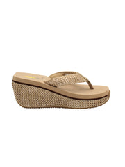 The Island thong sandal by Volatile is crafted in woven raffia and set on a sturdy platform wedge covered in the same material. Our signature ultra-comfort EVA insole will keep toes happy all day long and the rubber traction outsole provides extra stability. Wear them with patterned dresses or denim shorts. natural raffia