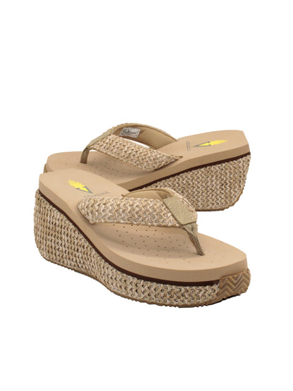 The Island thong sandal by Volatile is crafted in woven raffia and set on a sturdy platform wedge covered in the same material. Our signature ultra-comfort EVA insole will keep toes happy all day long and the rubber traction outsole provides extra stability. Wear them with patterned dresses or denim shorts. natural raffia 2